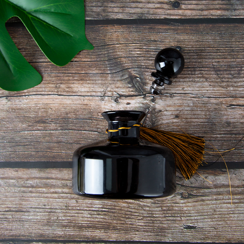 an open black essential oil glass jar packaging 02